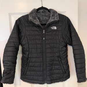 The North Face Women's reversable black Puffer Jacket.